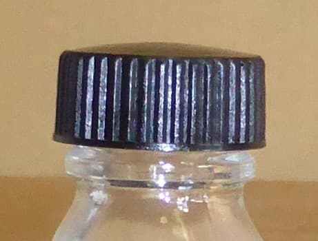 Cape en Bakélite noire avec joint caoutchouc pour flacon PH18