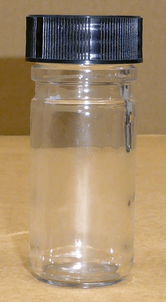 Flacon poudrier en verre avec cape à vis